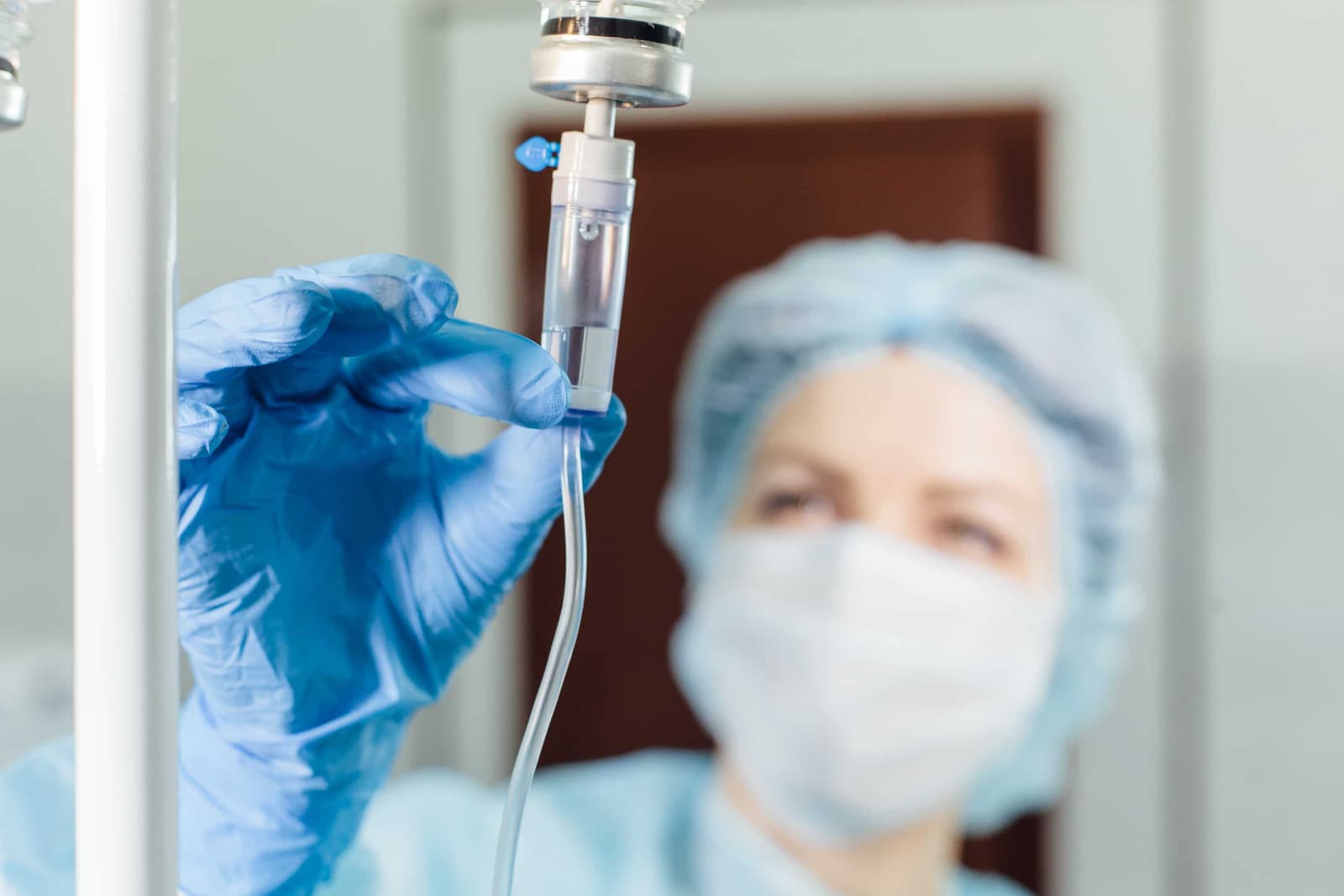 A nurse is seen preparing a chemotherapy treatment for a patient.